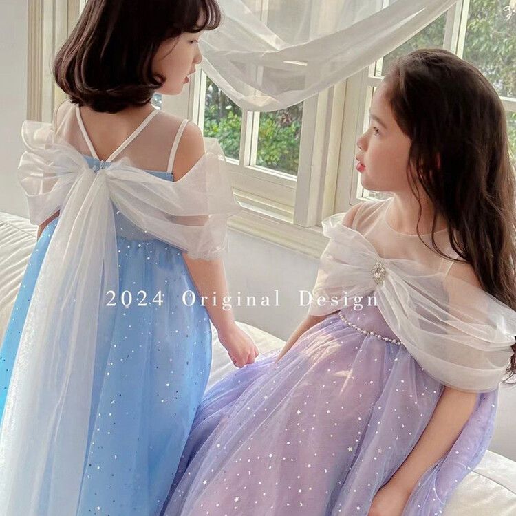 Girls' sparkly tulle kids dress with star sequin overlay and elegant cape sleeves - perfect for parties and special events