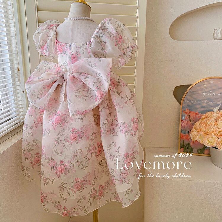 Cute girls floral puff sleeve kids dress with elegant bow and pearl detail - perfect for parties and birthdays