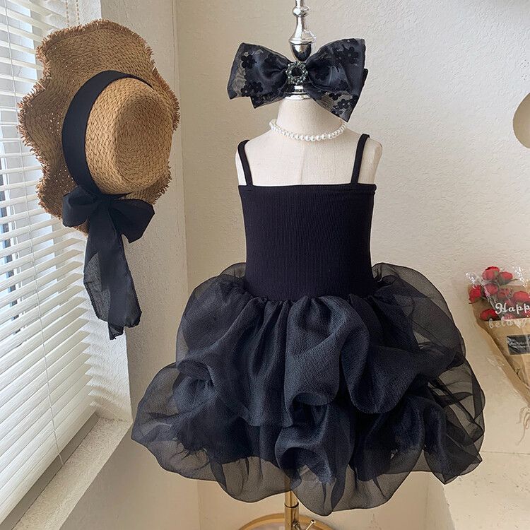 Chic girls' black and white tulle children's dress with tiered skirt and elegant spaghetti straps - perfect for formal events