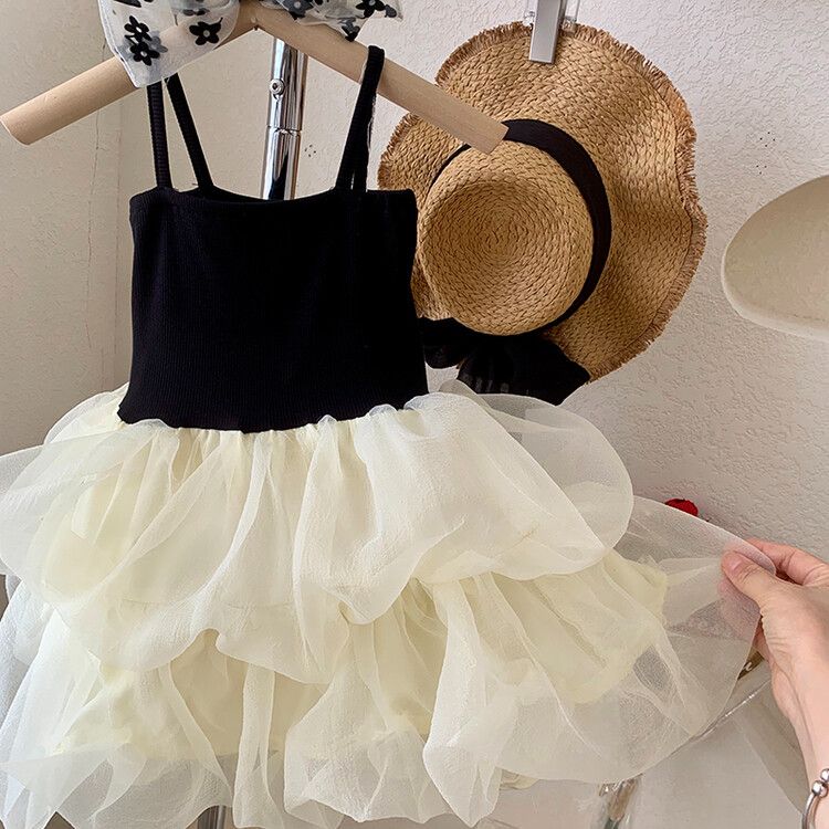 Chic girls' black and white tulle children's dress with tiered skirt and elegant spaghetti straps - perfect for formal events