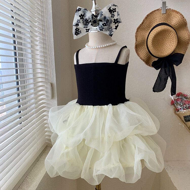 Chic girls' black and white tulle children's dress with tiered skirt and elegant spaghetti straps - perfect for formal events