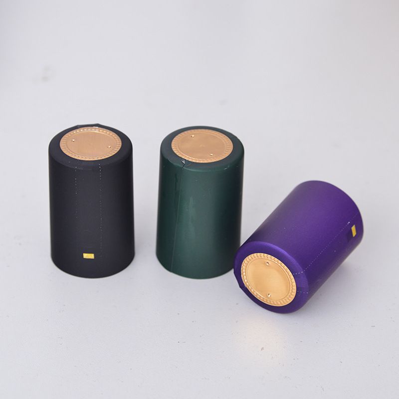 Custom Plastic Heat Shrink Capsules Lid PVC Embossed Capsule For Vodka Whiskey Liquor Bottle