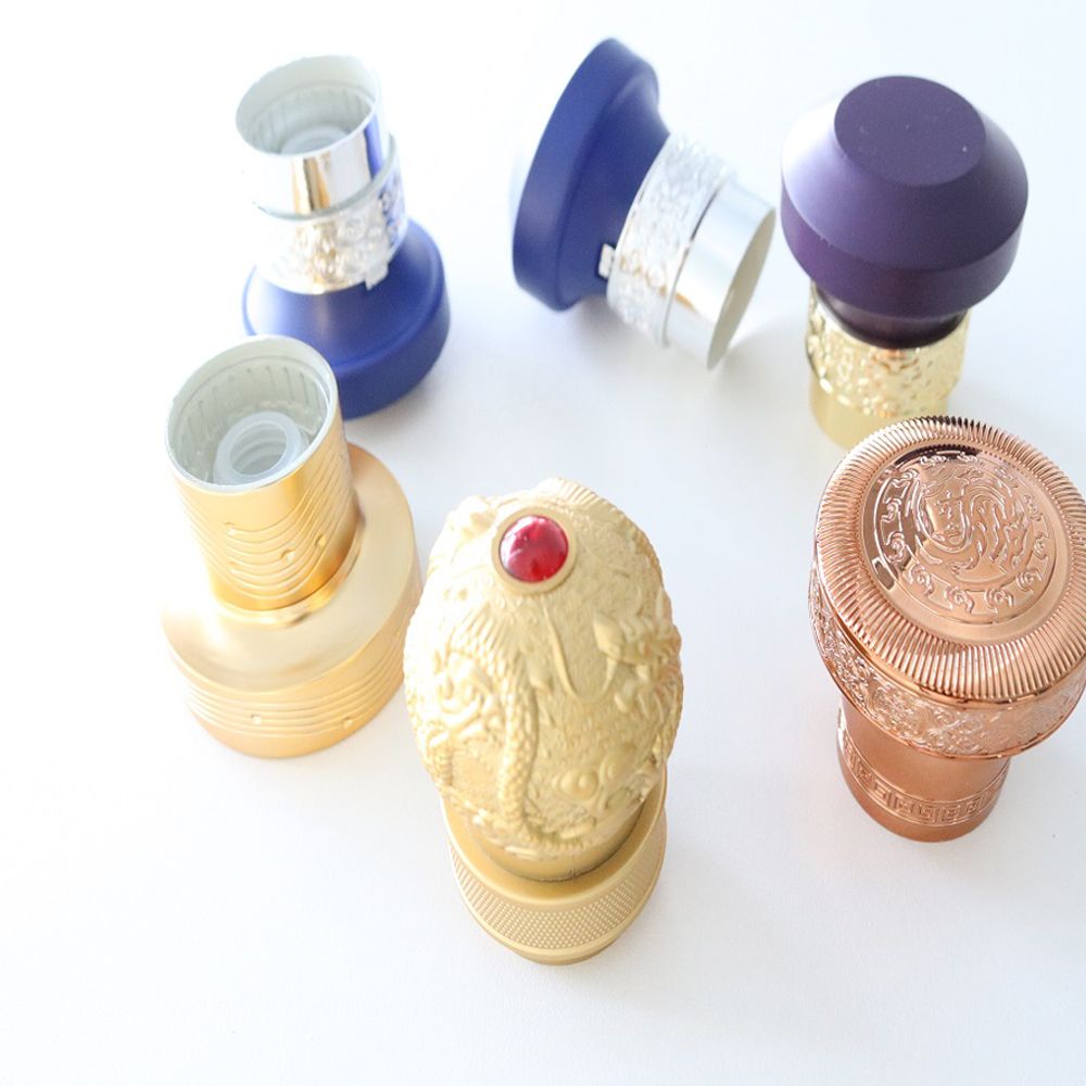 Low moq customized metal zinc alloy lid zamac perfume cap Irregular veins crown bottle stopper