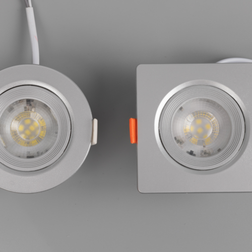 The high-efficacy downlight is more energy-efficient at providing the same brightness, reducing long-term electricity costs