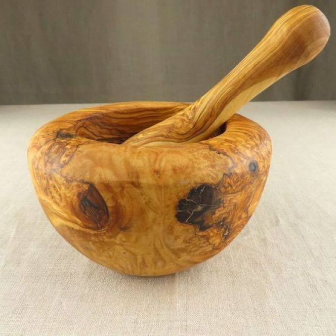 Large wooden mortar and pestle has items of garlic masher bowl, granite mortar and mortar salt.