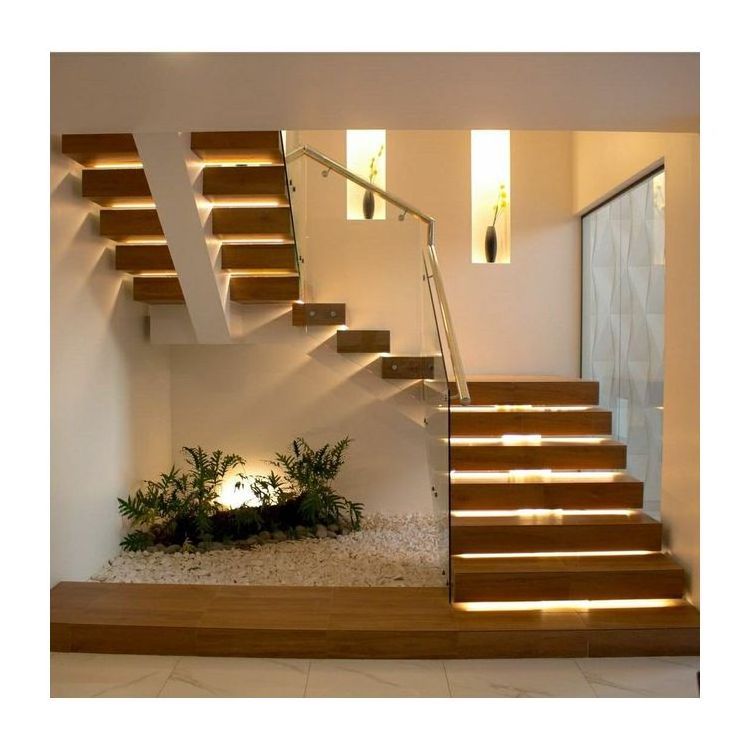 indoor light home stairs with floating design and glass railing