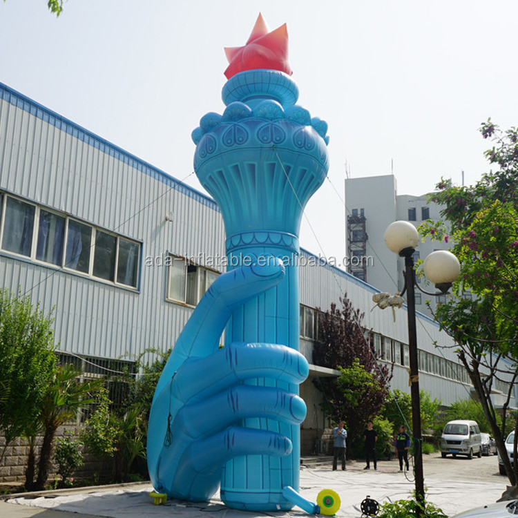 Size customized giant inflatable torch holding in hand for event ST1435