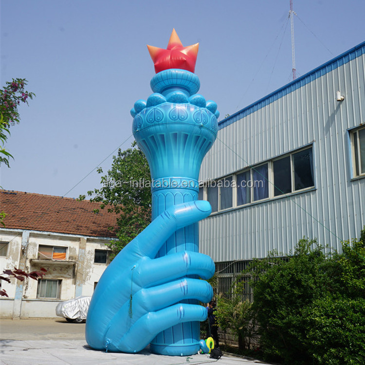 Size customized giant inflatable torch holding in hand for event ST1435