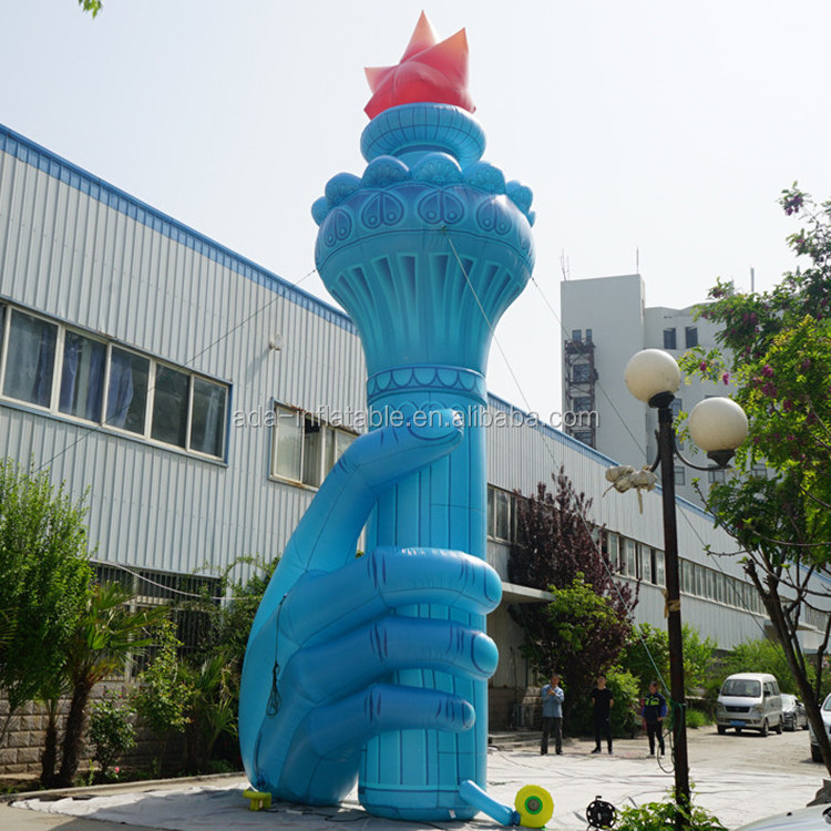 Size customized giant inflatable torch holding in hand for event ST1435