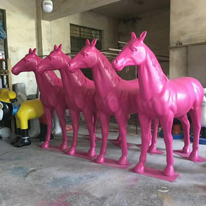 life-size large fiberglass horse sculpture in garden