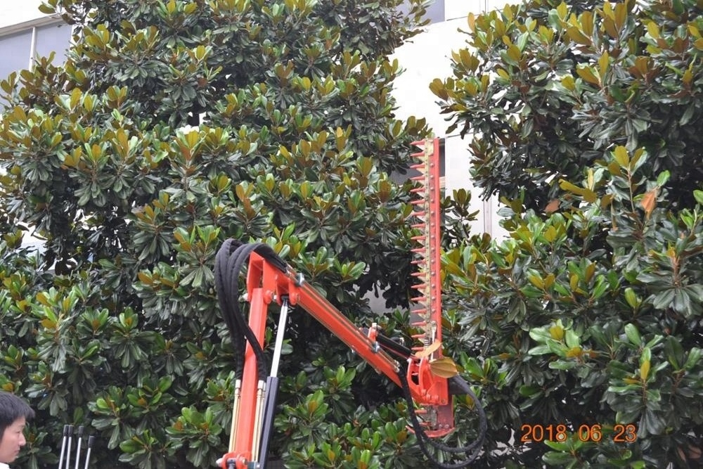 Tractor driven hydraulic hedge trimmer for cutting tree leaves