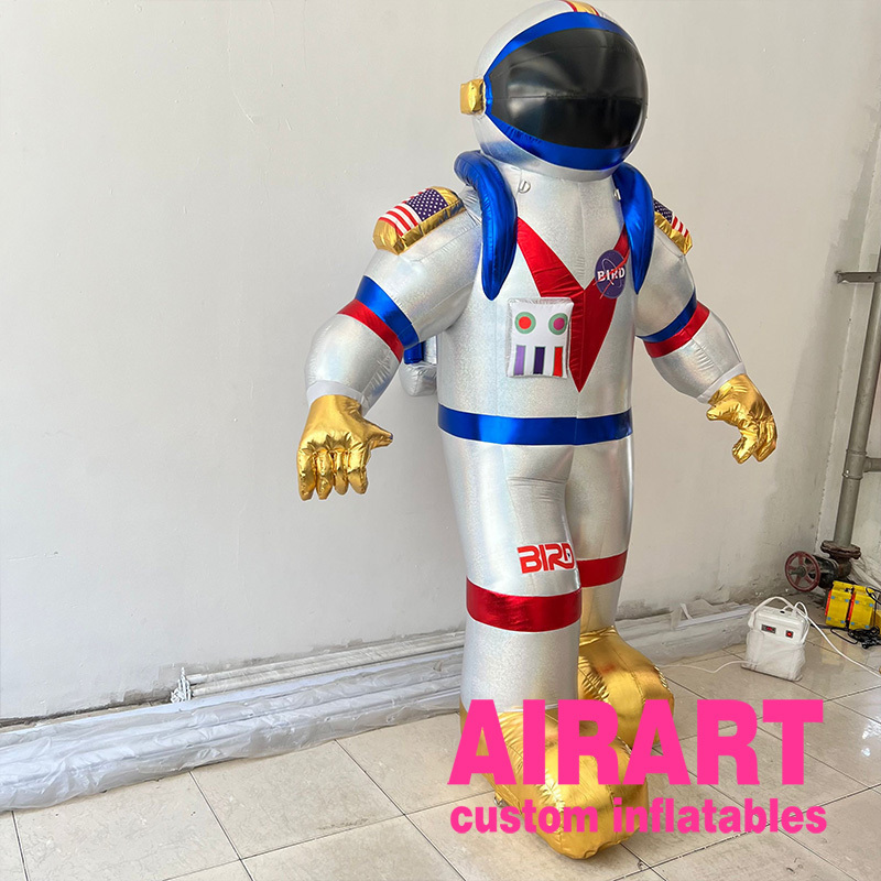 Advertising giant inflatable alien astronaut spaceman characters flying space man