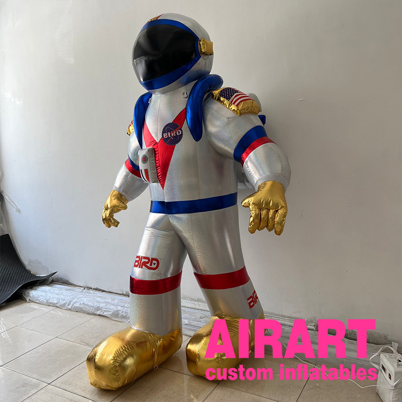 Advertising giant inflatable alien astronaut spaceman characters flying space man