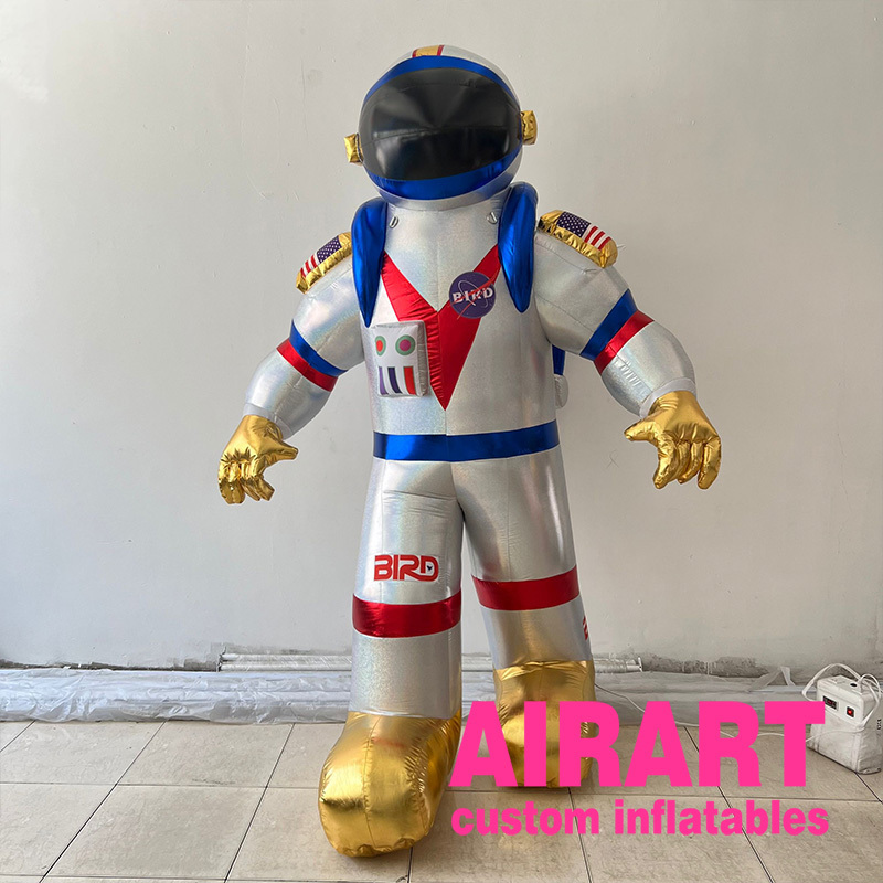 Advertising giant inflatable alien astronaut spaceman characters flying space man