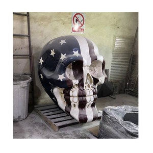 Customized Fiberglass life size outdoor Garden decoration large hand carved colored drawing skulls statue sculpture