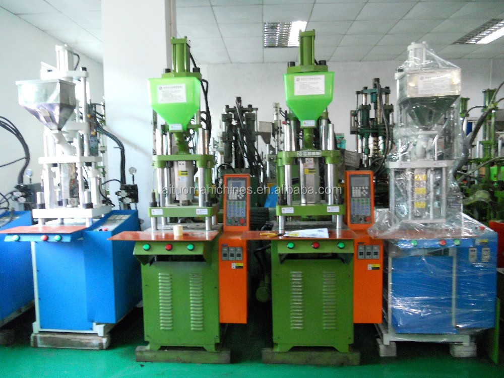 Small vertical injection machine for molding charger cable