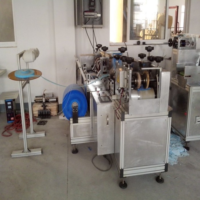 New color plastic shoe cover making machine