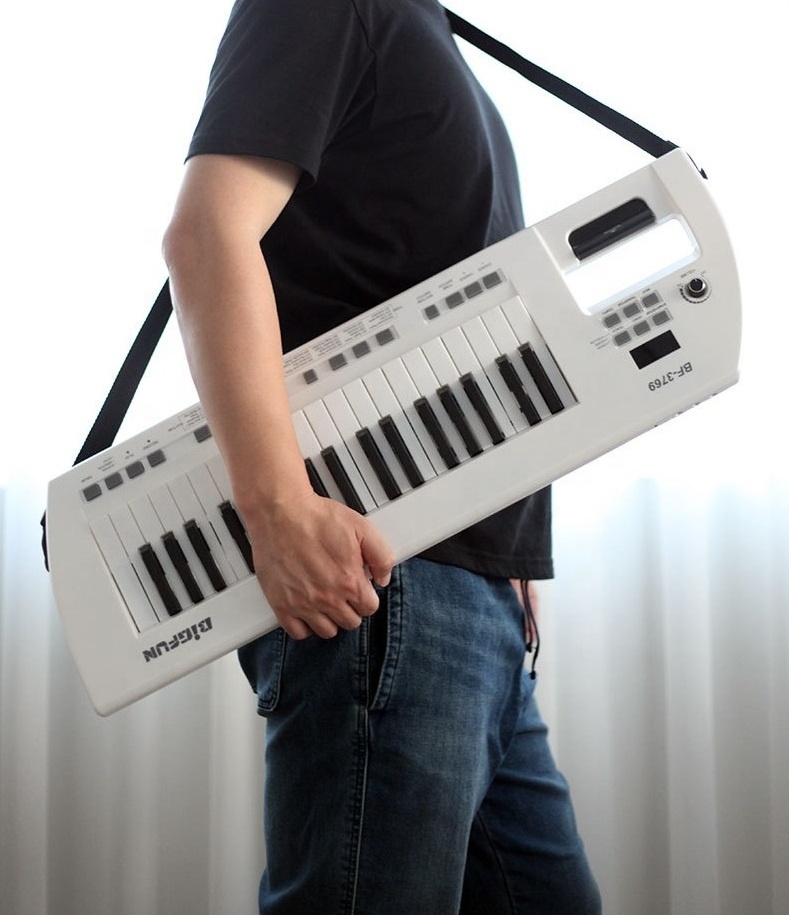 High quality hot-selling 37 key back-shoulder-carrying mini-sized guitar style sustain electronic organ keyboard piano