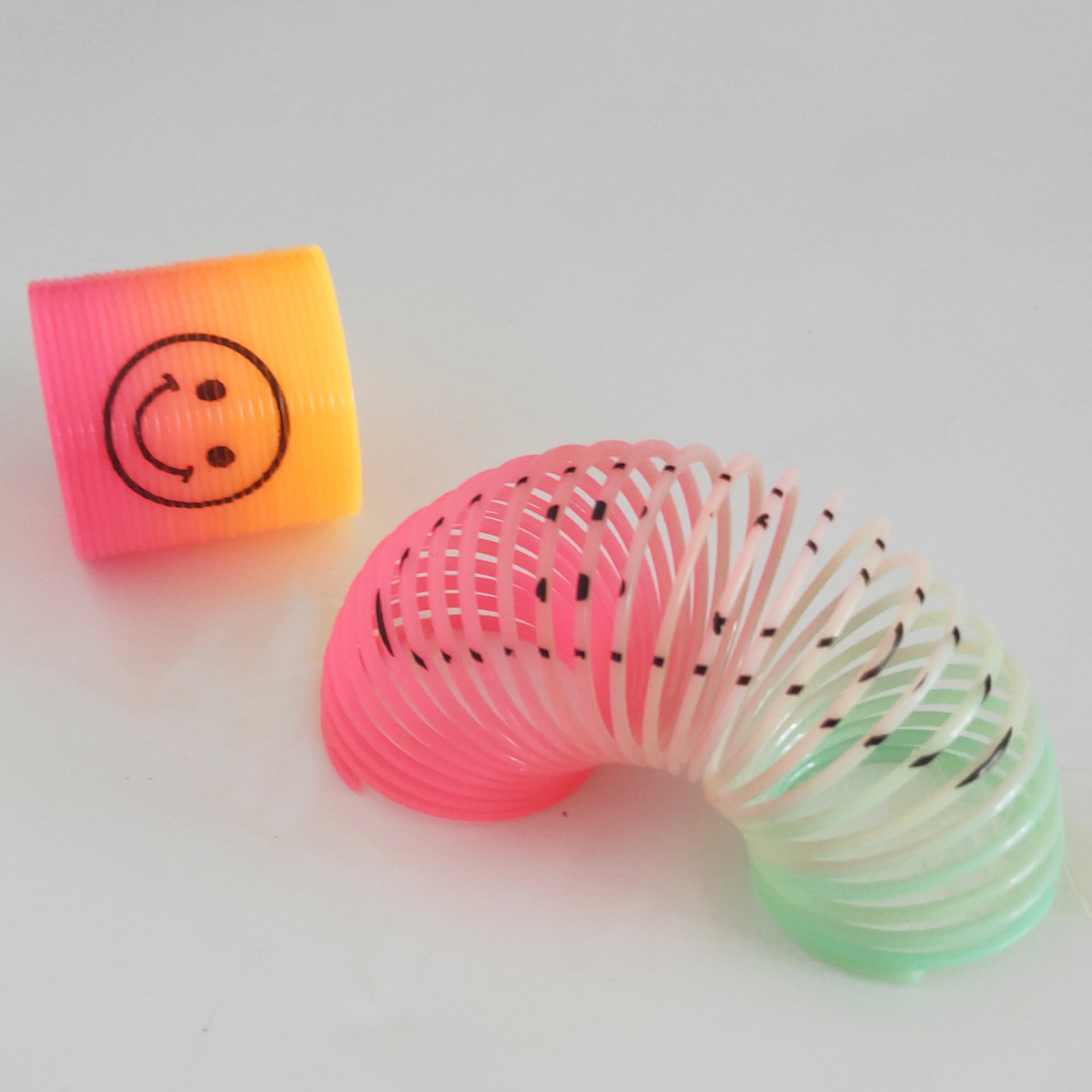 Small Plastic Rainbow Smiling Face Spring Coil Toys Magic Spring Classic Educational Gift For Kids