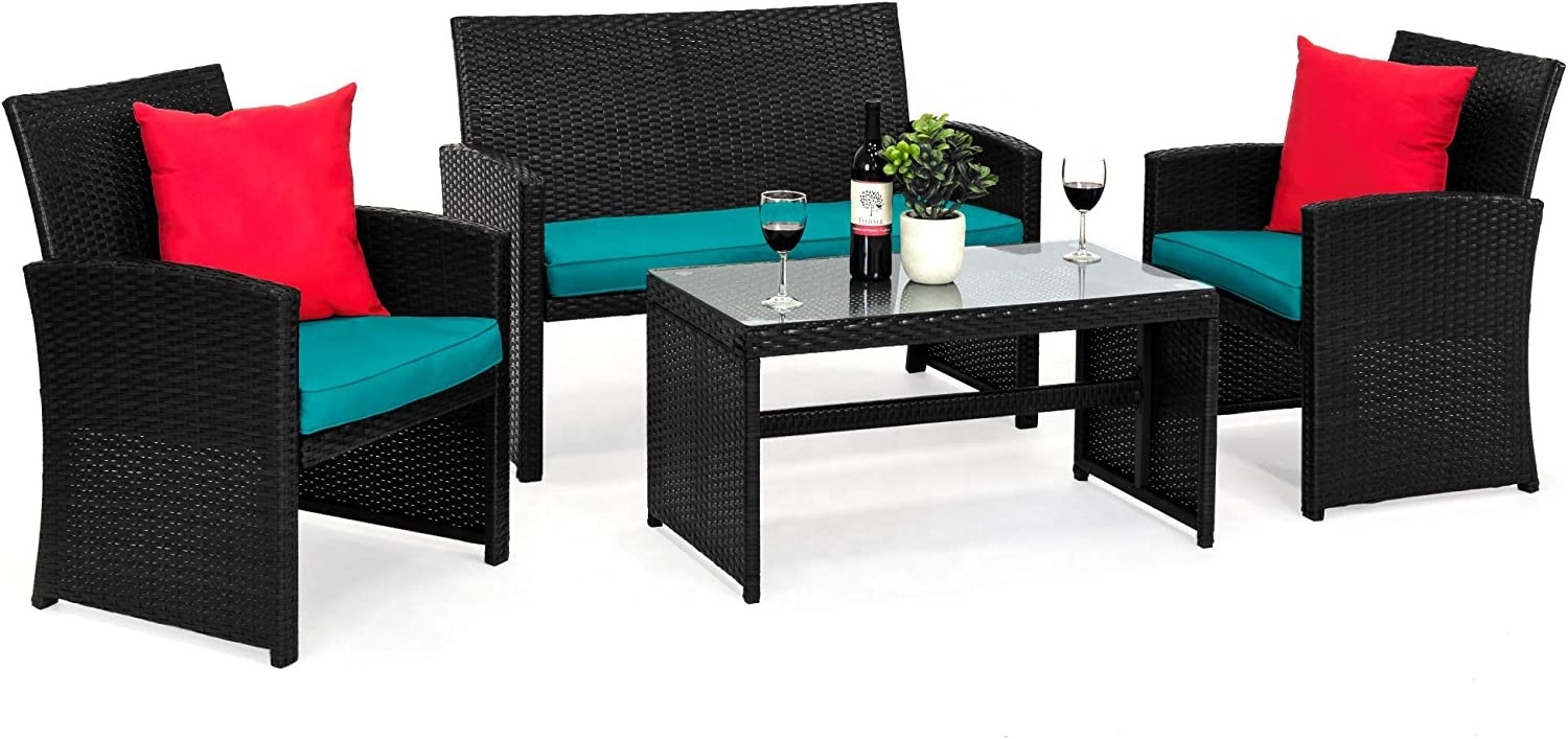 Black 4-piece outdoor wicker patio furniture set with backyard, deck, poolside coffee table, pool seat cushions