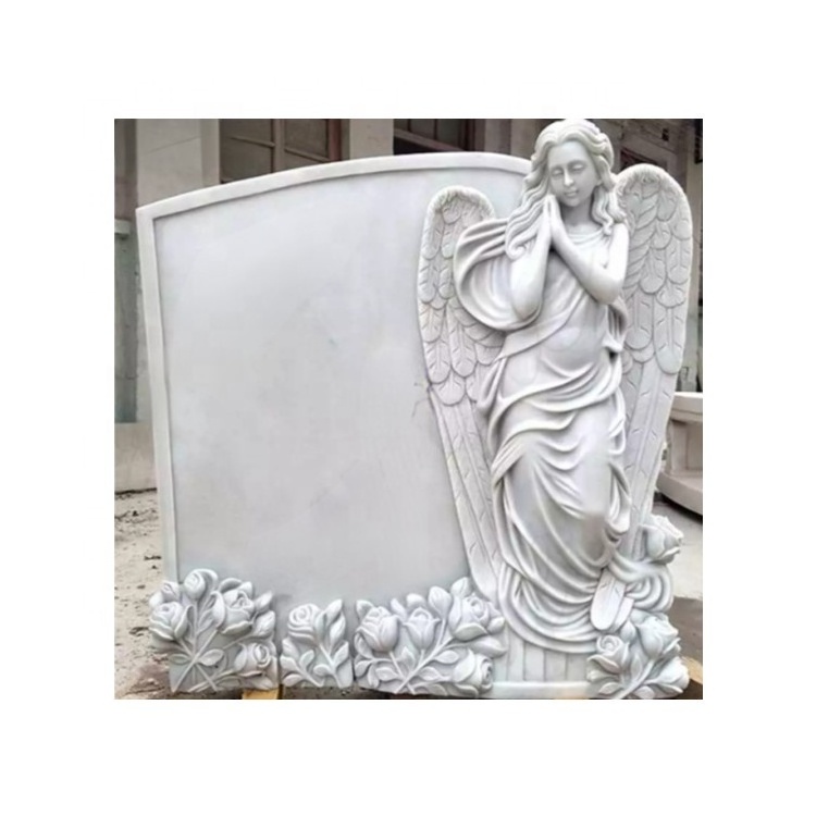 White marble gravestone with sculpture sad angel with head down