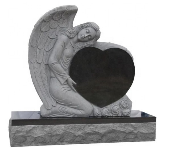 White marble gravestone with sculpture sad angel with head down