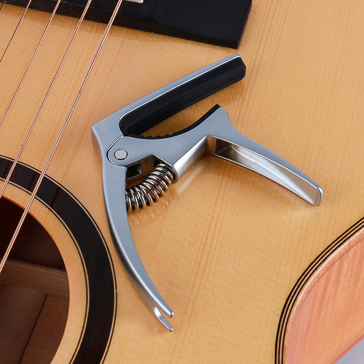 Custom logo multi function classical acoustic guitar accessories capo with picks