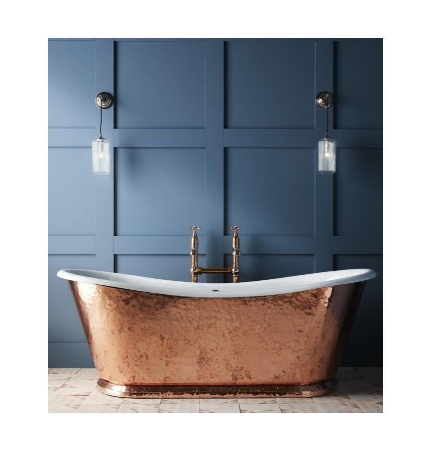 copper bathtub in shiny metal