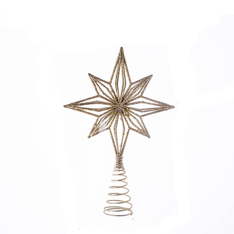 The new plastic Christmas star sparkles with gold and white stars on top of the tree decorations