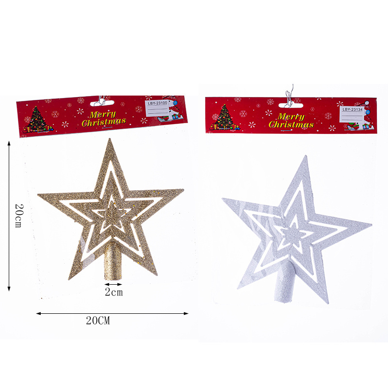 The new plastic Christmas star sparkles with gold and white stars on top of the tree decorations