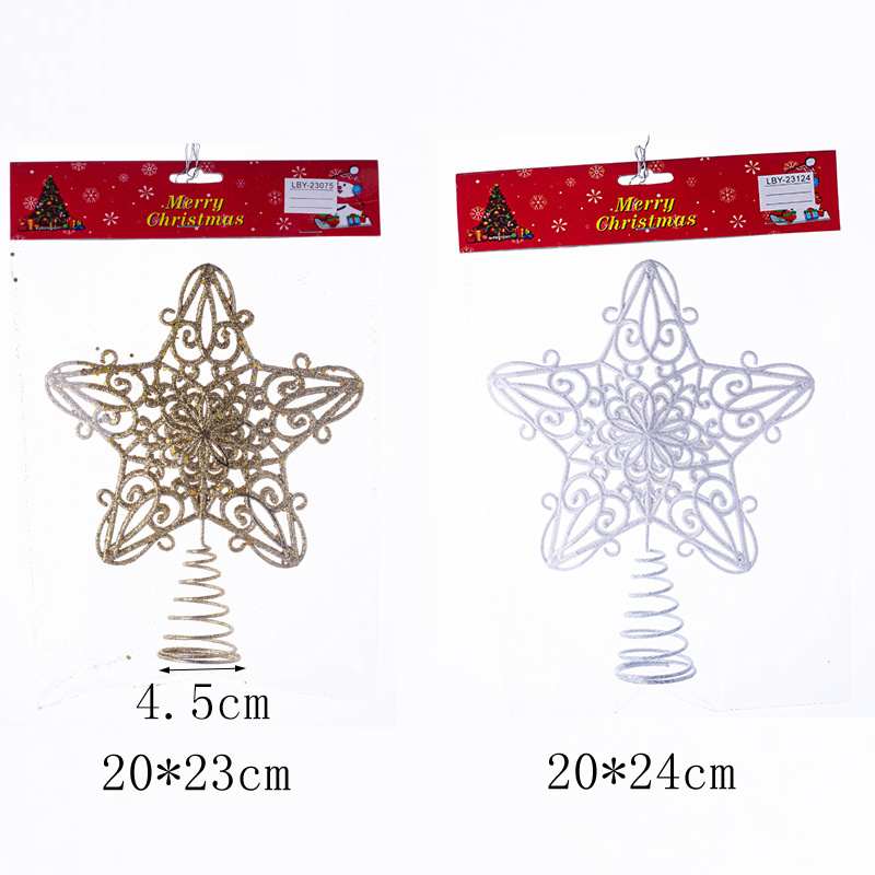 The new plastic Christmas star sparkles with gold and white stars on top of the tree decorations