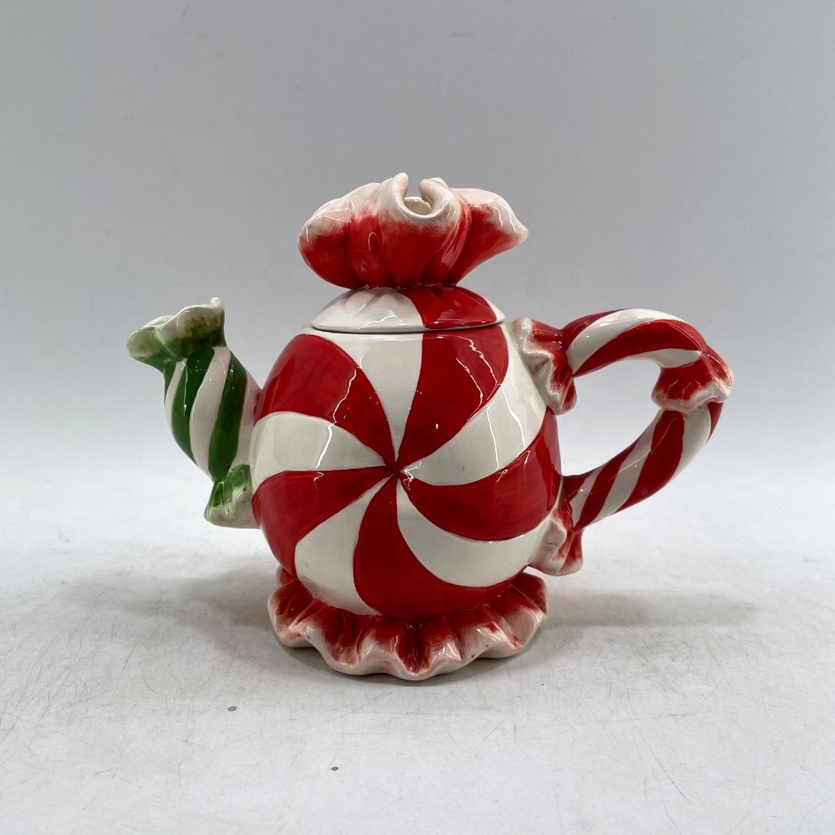 Hand-painted ceramic kettle for holiday decoration