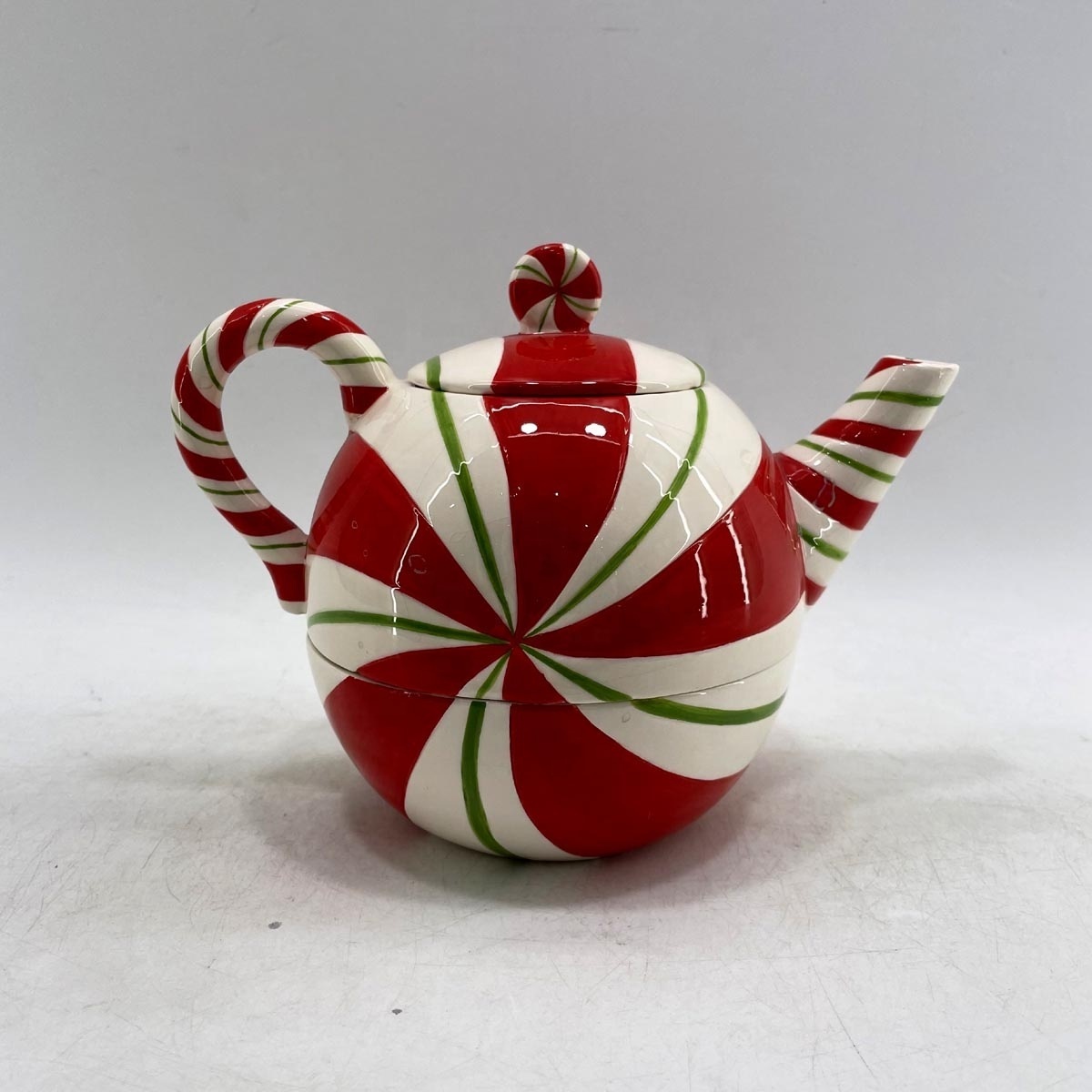 Hand-painted ceramic kettle for holiday decoration