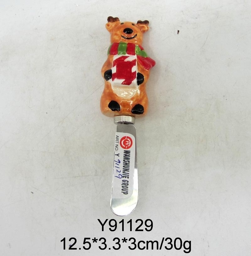 Spreader with ceramic snowman handle for Christmas decoration