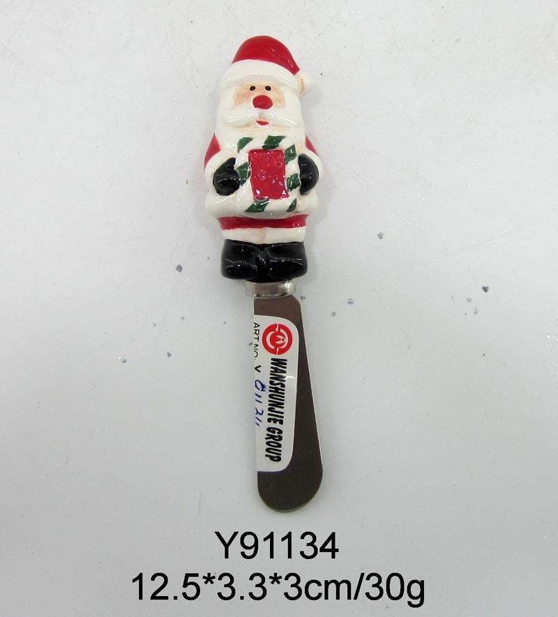 Spreader with ceramic snowman handle for Christmas decoration