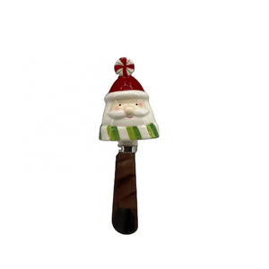 Stainless steel cheese spreader with ceramic santa handle