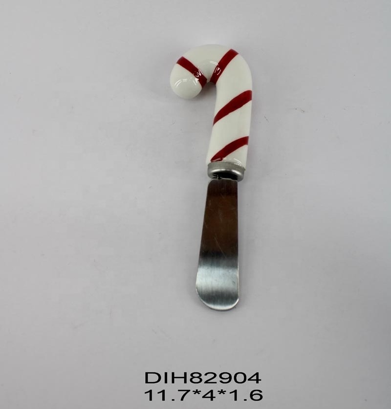 Cheese spreader with hand-painted ceramic gingerbread man handle