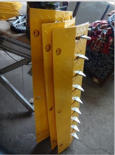 A standard block one way road spike barrier steel tyre killer