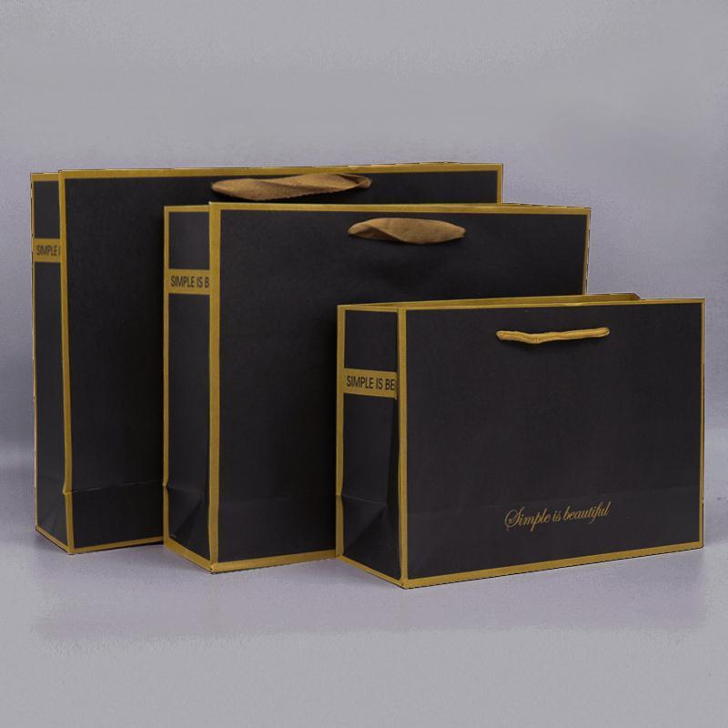 High Quality Thickened Kraft Paper Clothing Bag Black Kraft Paper Shopping Bag Sturdy And Durable With Customizable Logo