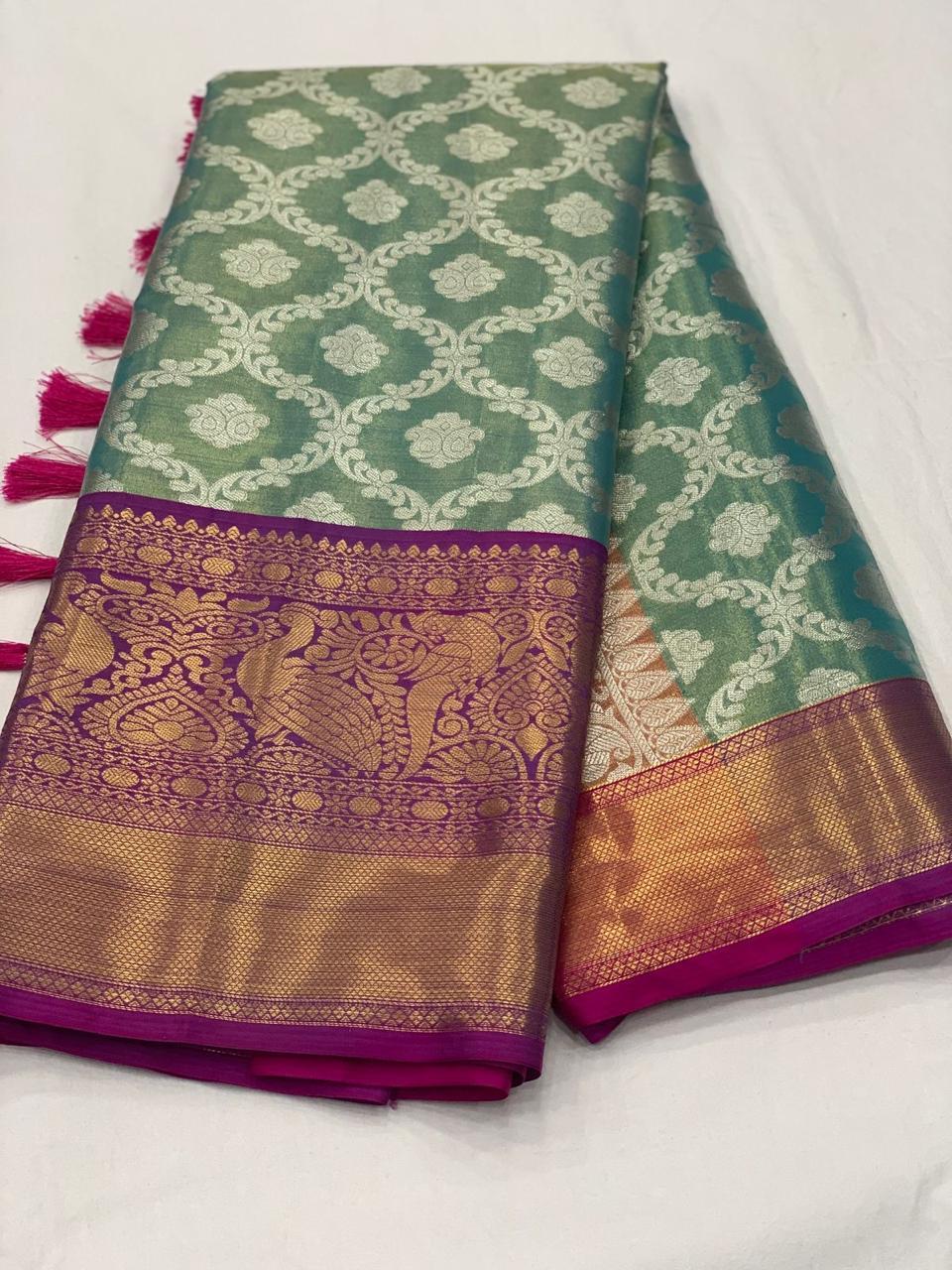 Kanjivaram silk fabric with Zari weawing pallu and contrast Zari weawing big border and all over Motifs in saree with Fancy