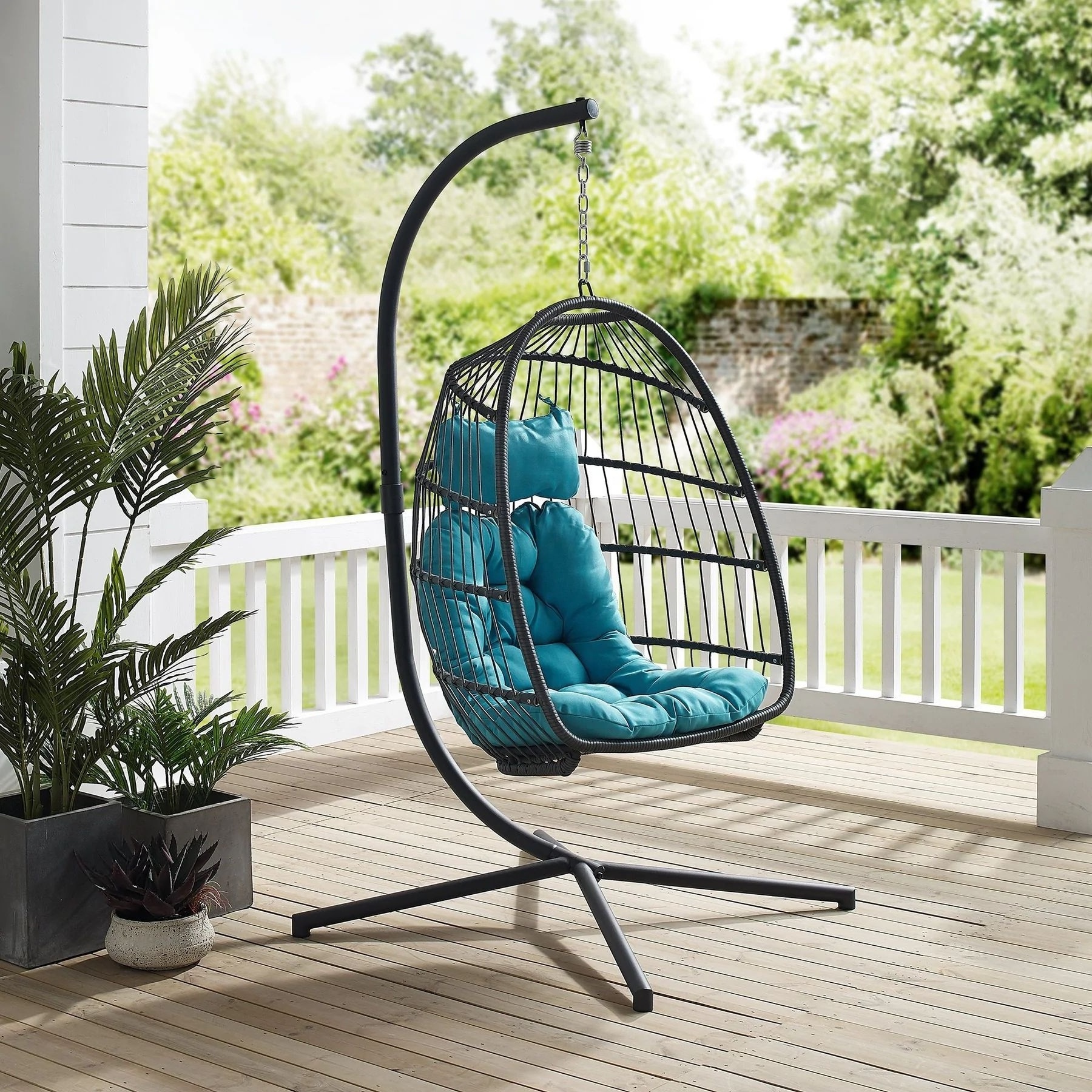 LeisureMod Patio Black Wicker Folding Hanging Egg Swing Chair in Pink