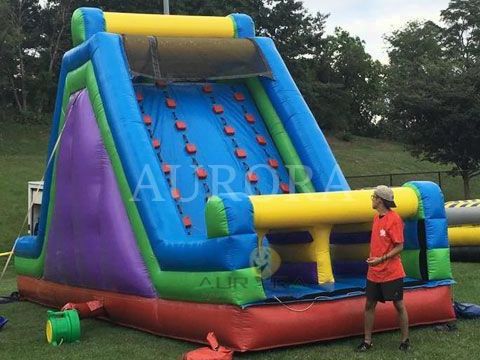 Commercial outdoor playground jumping slide rock wall climb and slide inflatable vertical rush obstacle slide for kids adults