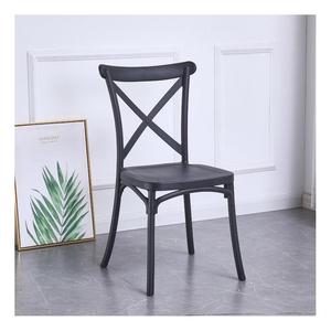 wholesale hot hotel luxury chair modern PP designer black plastic dining wedding chair cross back events chair for restaurant