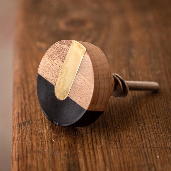 This cabinet knob is a unique mixture of resin and wood The brown wood merges well with the white resin The wood  grains and