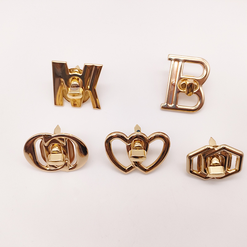 Wholesale New Design Letter Hollowed-Out Metal Turn Locks Custom Brand Letter Logo Push Twist Lock For Bag Accessories