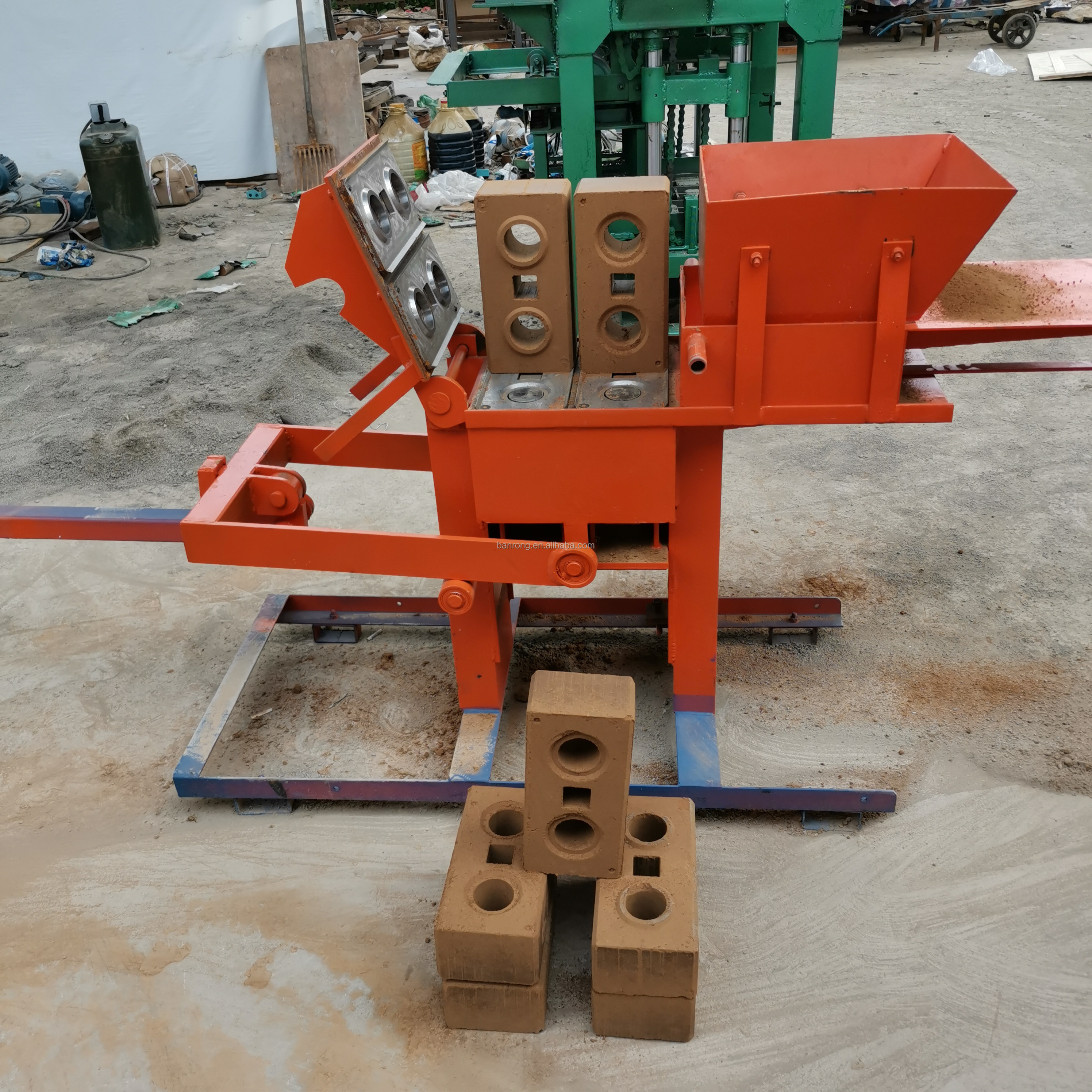 Hot selling manual press clay interlocking brick machine price