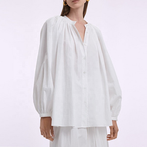 Women button down blouse in crisp cotton poplin featuring voluminous balloon sleeves ruched detailing at neckline linen blouse