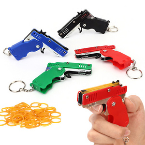 Mini Keychain Rubber Gun Elastic Leather Rubber Band Blaster Toys Shooting Pistol Kids Party Folding Elastic Rope Gun