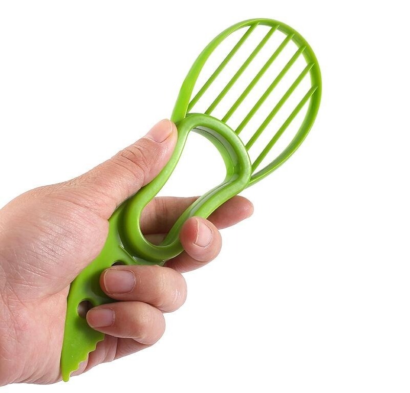 New product 2023 Hand hold plastic fruit cutter kiwifruit cutter avocado cutter kitchen gadgets for easy peeling and slicer