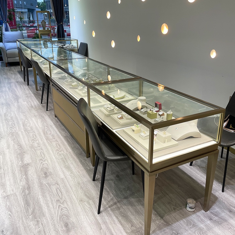 Gold Stainless Steel Jewelry Shop Display Cabinet Showcase Elegant Glass Jewelry Display Counter with Lights For Jewelry Store